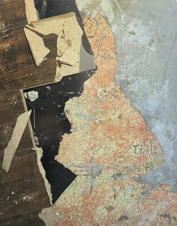 Photograph of a partially peeled and weathered floor showing layers of wood, black material, and worn orange and yellow surfaces beneath, resembling an abstract composition.