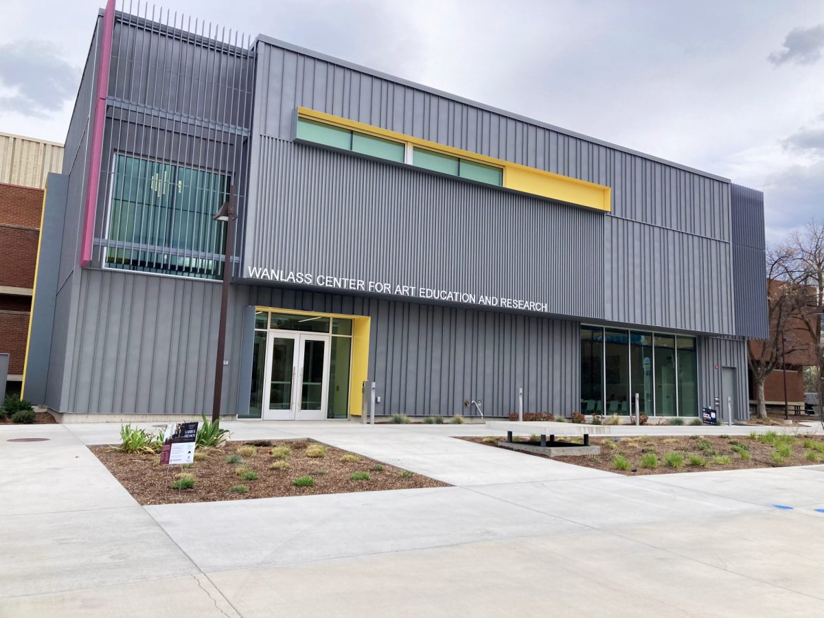 Exterior of the Wanlass Center for Art Education and Research, a modern gray building with large windows at Utah State University.