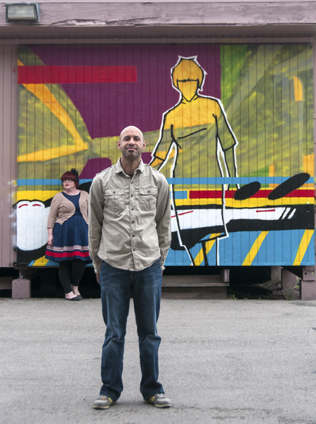 Blake and Cat Palmer in front of his mural at the SLC Arts Hub, photo by Gerry Johnson