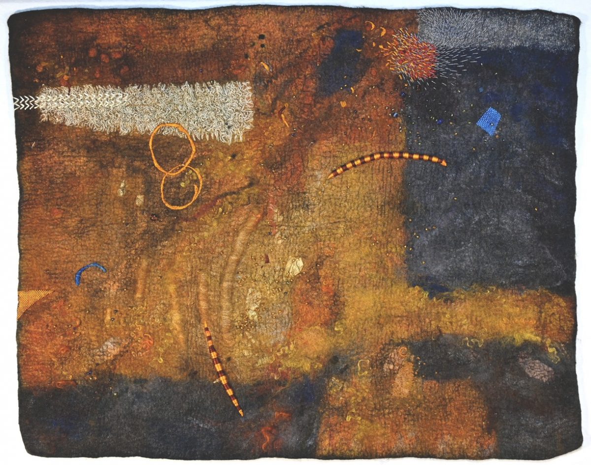 An abstract felt artwork with a rich, earthy palette. The piece includes elements like stitched circles, vibrant lines, and textured patterns, creating a dynamic composition.
