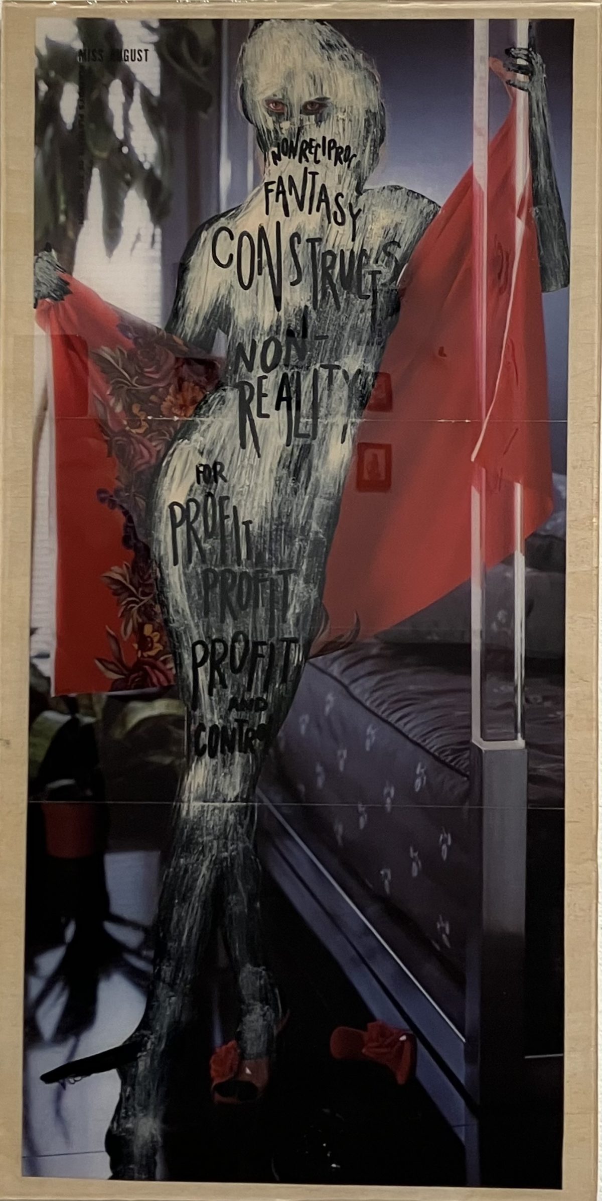 A figure in a classic Playboy pose is obscured by expressive white paint and handwritten black text reading “Non-reciprocal fantasy constructs non-reality for profit, profit, profit and control.” The background includes a bed, red robe, and high heels, evoking a domestic yet hypersexualized setting.