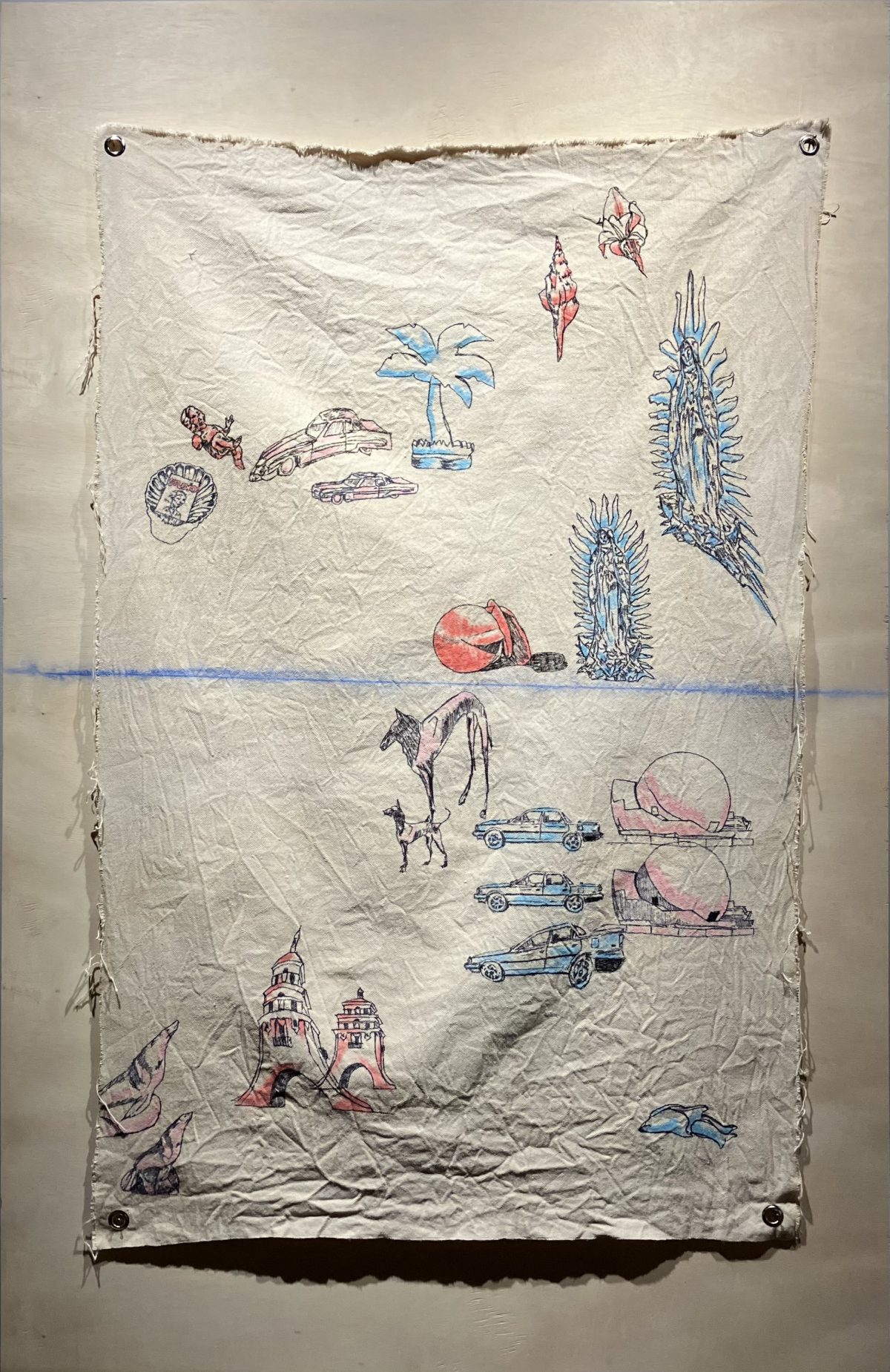 A mixed-media textile work by Mao Barroteran featuring embroidered icons such as cars, palm trees, religious figures, and animals stitched on a wrinkled canvas, with a blue horizontal line symbolizing a horizon that continues onto the backing panel.